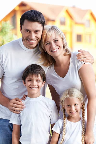 Family in front of house